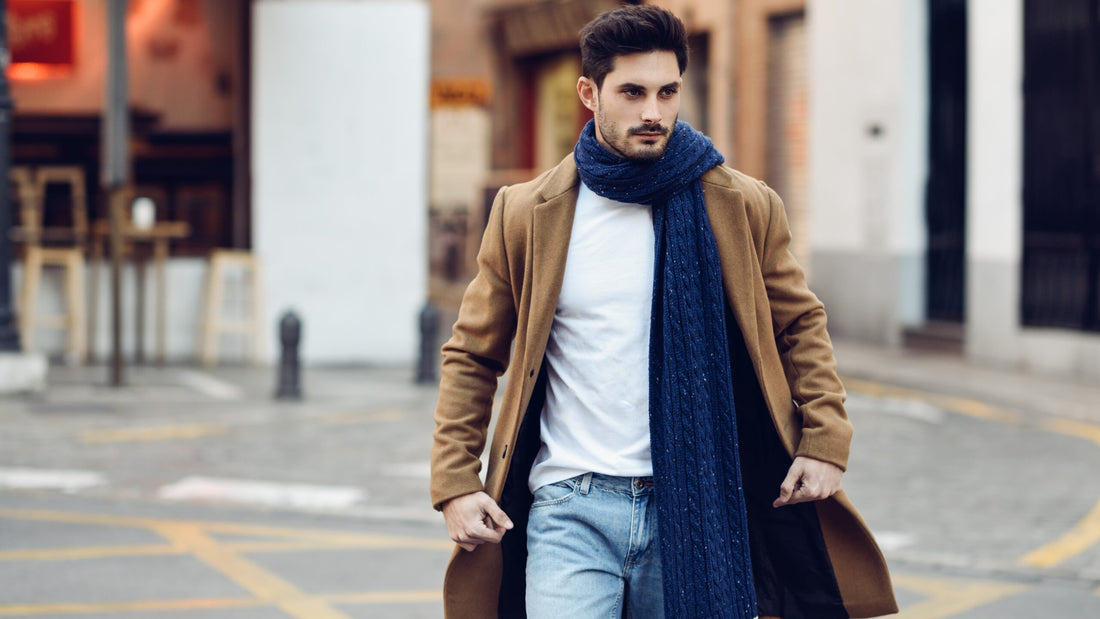 Young man wearing winter clothes in the street.